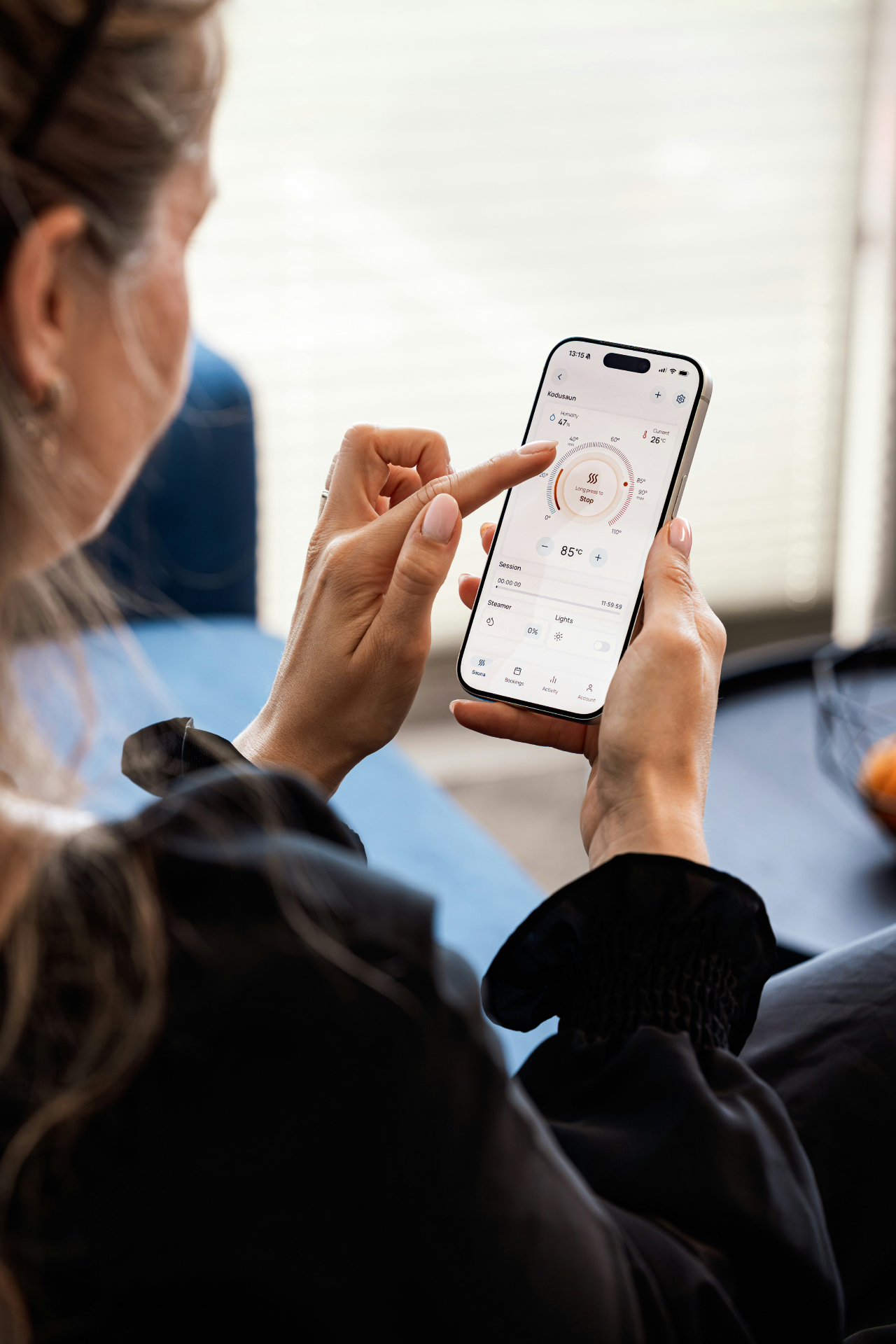 Customer controlling smart home heating and lighting from a mobile app