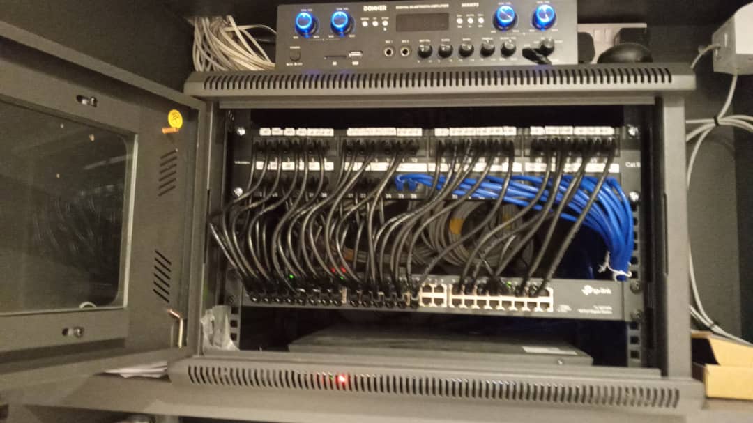 Commercial HD CCTV installation with PoE switch and patch panel, North London — photo 2