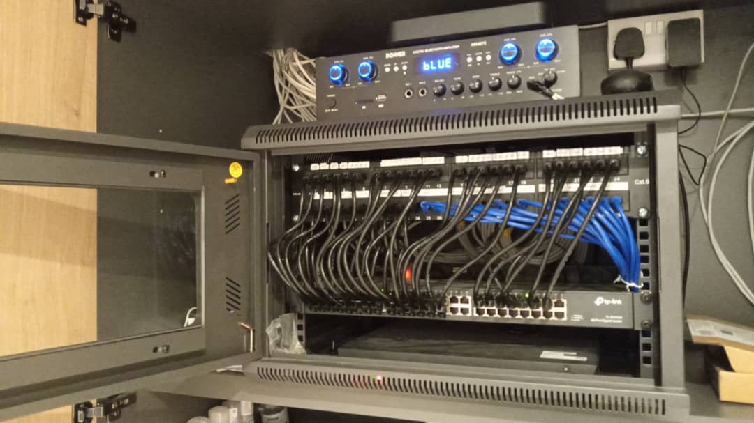 Commercial HD CCTV installation with PoE switch and patch panel, North London